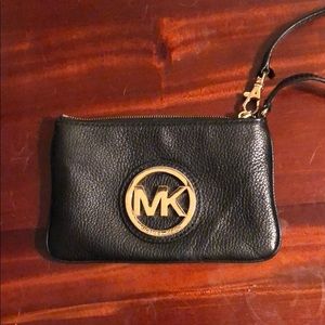 Mk black leather clutch